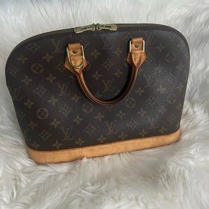 Authentic Louis Vuitton Alma PM vintage in monogram coated canvas